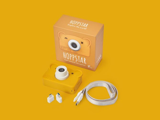 alt="Hoppstar - Appareil photo numérique pour enfant - Appareil photo numérique avec housse en silicone - Rookie Honey packaging"
